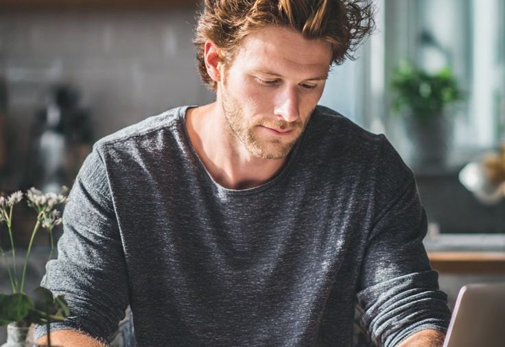 Man reviewing bills — Lending Buddy bad credit loans
